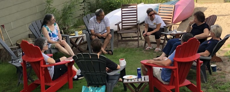 community leaders sitting in a circle of chairs