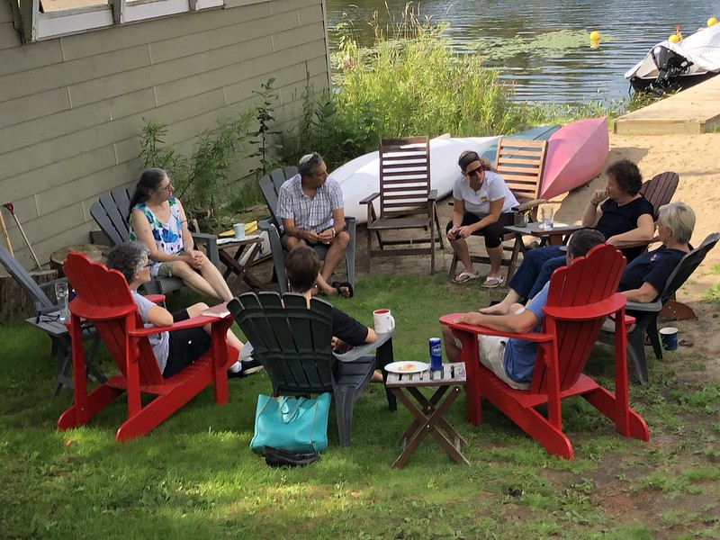 community leaders sitting in a circle of chairs